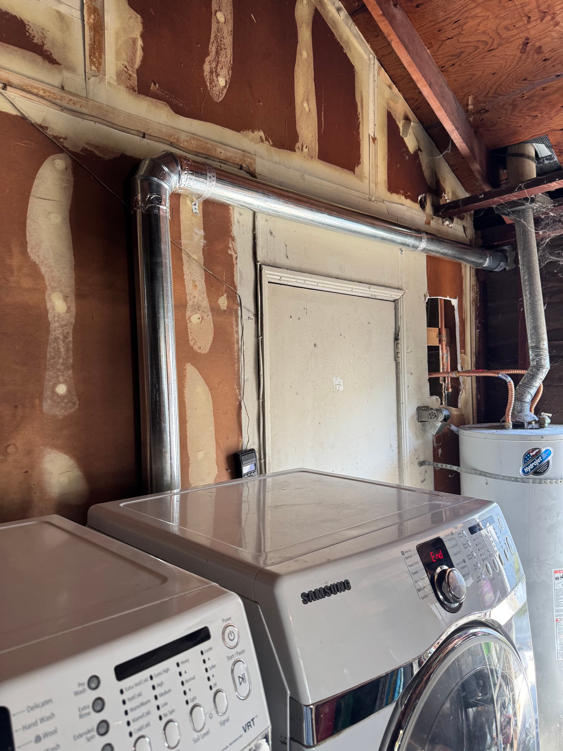 Gallery photos for Dryer Vent Rerouted to Exterior for Better Airflow: Image #1